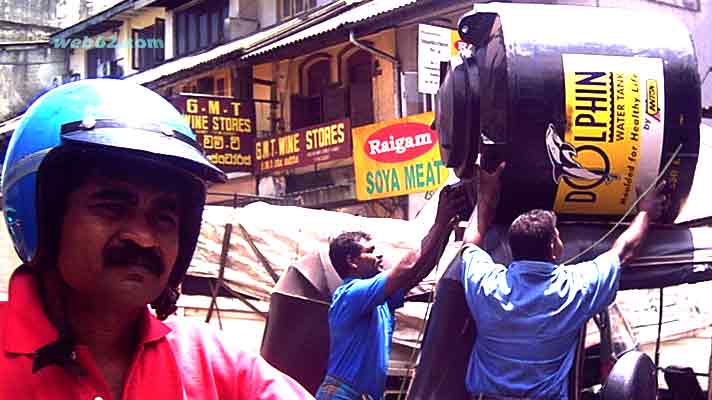 men at work in Kandy, Sri Lanka