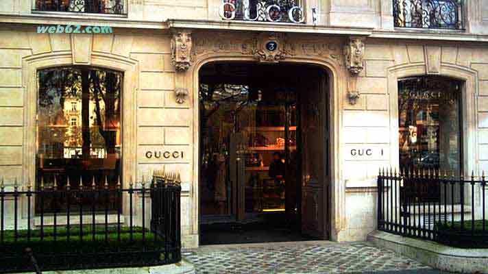 gucci a paris,facade of a italian fashion gucci store shop in paris france